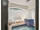Indoor spa room featuring a waterfall feature, tiled walls, and a seating area for relaxation at 9807 Bay Island Dr, Tampa, FL 33615