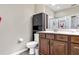 Bathroom featuring a vanity with cabinets and drawers, plus a toilet and shower at 11638 Palmetto Pine St, Riverview, FL 33569