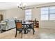 Bright dining area with tile flooring and views of the living room at 11638 Palmetto Pine St, Riverview, FL 33569