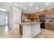 Kitchen island with granite counters, and stainless appliances at 11638 Palmetto Pine St, Riverview, FL 33569