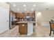Spacious kitchen featuring a central island, stainless steel appliances, and ample cabinet space at 11638 Palmetto Pine St, Riverview, FL 33569