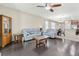 Spacious living room featuring hardwood floors and comfortable light blue sofas at 11638 Palmetto Pine St, Riverview, FL 33569