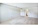 Spacious bedroom with light-colored walls, carpet, and access to a bathroom at 1218 Haddington Cir, Sun City Center, FL 33573