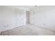 Bright bedroom featuring neutral carpeting and closet with panel doors at 1218 Haddington Cir, Sun City Center, FL 33573