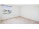 Bright bedroom with a window, neutral-colored walls, and soft carpet at 1218 Haddington Cir, Sun City Center, FL 33573