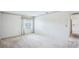 Well-lit bedroom with neutral walls, soft carpet, and a window view at 1218 Haddington Cir, Sun City Center, FL 33573