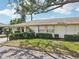 Home exterior showing well maintained front yard and covered parking at 1218 Haddington Cir, Sun City Center, FL 33573