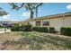 Well-maintained home with lush green lawn, mature shrubs, and a tidy facade at 1218 Haddington Cir, Sun City Center, FL 33573