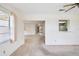 Spacious living area, providing seamless transition to the entry and adjacent kitchen area at 1218 Haddington Cir, Sun City Center, FL 33573