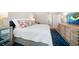 Bedroom with bright natural light, a comfortable queen bed, and en-suite bathroom access at 14810 Rue De Bayonne # 2D, Clearwater, FL 33762