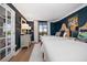 Serene bedroom featuring two beds, stylish decor, and a balcony with views at 14810 Rue De Bayonne # 2D, Clearwater, FL 33762