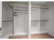 Walk-in closet with custom built-in shelving and ample storage space at 14810 Rue De Bayonne # 2D, Clearwater, FL 33762