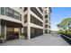 Exterior of a building featuring large screened patios with stunning views of the golf course at 14810 Rue De Bayonne # 2D, Clearwater, FL 33762