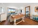 Bright living room features an entertainment area with a large outdoor window and view of the yard at 14810 Rue De Bayonne # 2D, Clearwater, FL 33762