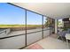 Spacious screened patio with stunning views of lush green landscape and clear blue skies at 14810 Rue De Bayonne # 2D, Clearwater, FL 33762