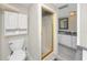 Bathroom showcasing a standing shower with glass doors and a vanity with a mirror at 157 7Th Sw Ave, Largo, FL 33770