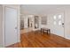 Bright foyer with hardwood floors, a white door, and a seamless flow into the kitchen at 157 7Th Sw Ave, Largo, FL 33770