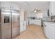 Bright kitchen with white cabinets, stainless steel appliances, and a practical layout at 157 7Th Sw Ave, Largo, FL 33770