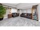 Comfortable living room featuring hardwood-style floors, two sofas, and built-in shelves at 157 7Th Sw Ave, Largo, FL 33770