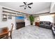 Inviting living room with built-in shelving, hardwood floors, and large TV at 157 7Th Sw Ave, Largo, FL 33770