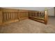Loft with wood railings and neutral carpet at 157 7Th Sw Ave, Largo, FL 33770