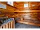 Relaxing sauna room featuring wood paneling, seating, and traditional sauna stones, perfect for unwinding after a long day at 157 7Th Sw Ave, Largo, FL 33770
