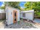 View of sauna featuring wood construction and an orange trimmed door at 157 7Th Sw Ave, Largo, FL 33770