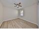 Bedroom with wood-look flooring, neutral paint, and natural light at 1612 Cabbage Key Dr, Ruskin, FL 33570