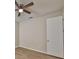 Bedroom with wood-look flooring, neutral paint, and ceiling fan at 1612 Cabbage Key Dr, Ruskin, FL 33570