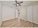 Bedroom with light wood floors, closet and ensuite bath access at 1612 Cabbage Key Dr, Ruskin, FL 33570