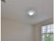 Bright and neutral ceiling with installed light fixture and air conditioning vent at 1612 Cabbage Key Dr, Ruskin, FL 33570