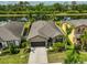 Inviting single-Gathering home featuring lush landscaping, neutral paint and a spacious driveway at 1612 Cabbage Key Dr, Ruskin, FL 33570