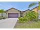 Charming single-Gathering home featuring a well-manicured lawn and a two-car garage at 1612 Cabbage Key Dr, Ruskin, FL 33570