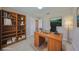 Cozy office space featuring a large desk, bookcase and natural lighting at 1612 Cabbage Key Dr, Ruskin, FL 33570