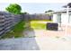 Spacious fenced backyard offering a private outdoor area with potential for landscaping and recreation at 1741 Fairfield St, Holiday, FL 34691