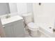 Modern bathroom featuring gray cabinets, white countertops, and a shower at 1741 Fairfield St, Holiday, FL 34691