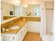 Bright bathroom with granite countertops, a spacious vanity, and a shower featuring decorative tile accents at 1741 Fairfield St, Holiday, FL 34691