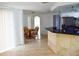 Bright dining area with tile floors, a round wood table, and lots of light at 1741 Fairfield St, Holiday, FL 34691