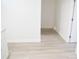 Hallway featuring luxury vinyl plank flooring and white walls at 1741 Fairfield St, Holiday, FL 34691