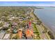 Stunning aerial view of waterfront homes with lush landscaping and city views at 2087 Edgewater Dr # C, Clearwater, FL 33755