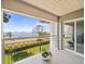 Enjoy the view from this balcony showing the water and landscaping at 2087 Edgewater Dr # C, Clearwater, FL 33755