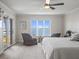 This primary bedroom features an amazing view and a cozy sitting area at 2087 Edgewater Dr # C, Clearwater, FL 33755