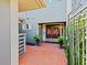 Welcoming front entryway featuring double doors and brick paving at 2087 Edgewater Dr # C, Clearwater, FL 33755