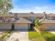 Charming townhome featuring well-manicured landscaping and an attached garage for convenient living at 2087 Edgewater Dr # C, Clearwater, FL 33755