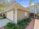 Charming home featuring a two-car garage and tidy landscaping at 2087 Edgewater Dr # C, Clearwater, FL 33755
