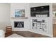 Corner fireplace with built-in shelving and mantel at 2087 Edgewater Dr # C, Clearwater, FL 33755