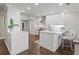 Modern eat-in kitchen with white cabinetry, updated appliances, and open sight lines at 2087 Edgewater Dr # C, Clearwater, FL 33755