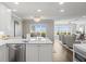 Bright, open kitchen with a view of the living area and beautiful waterfront views at 2087 Edgewater Dr # C, Clearwater, FL 33755