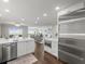 Open kitchen flows into living area with stainless steel appliances and waterfront views at 2087 Edgewater Dr # C, Clearwater, FL 33755