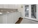 Bright and airy laundry area featuring ample counter space and a view to an outdoor area at 2087 Edgewater Dr # C, Clearwater, FL 33755